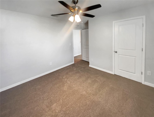 unfurnished bedroom with a ceiling fan, baseboards, and carpet floors