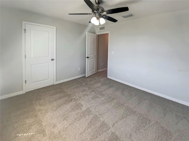 unfurnished bedroom with visible vents, baseboards, and carpet floors