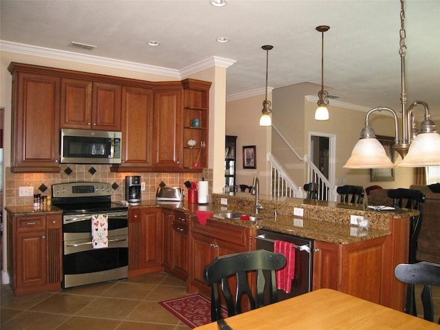 kitchen featuring a sink, backsplash, stainless steel appliances, a peninsula, and light tile patterned flooring