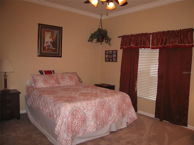 bedroom with ceiling fan, baseboards, carpet, and ornamental molding