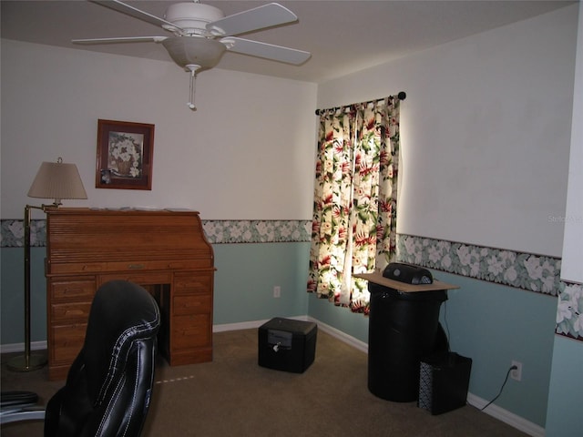 carpeted home office featuring a ceiling fan and baseboards