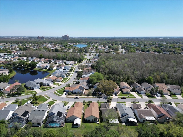 bird's eye view featuring a residential view and a water view