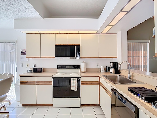 kitchen featuring white electric range oven, a sink, light countertops, dishwasher, and stainless steel microwave