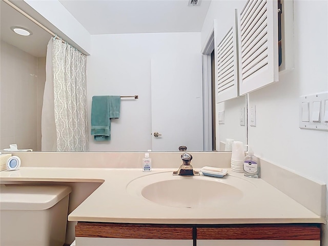 full bath with visible vents, toilet, and vanity