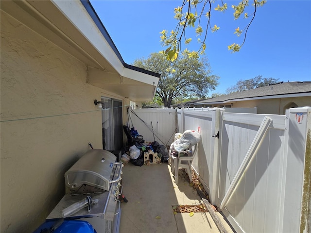 view of patio featuring grilling area and a fenced backyard