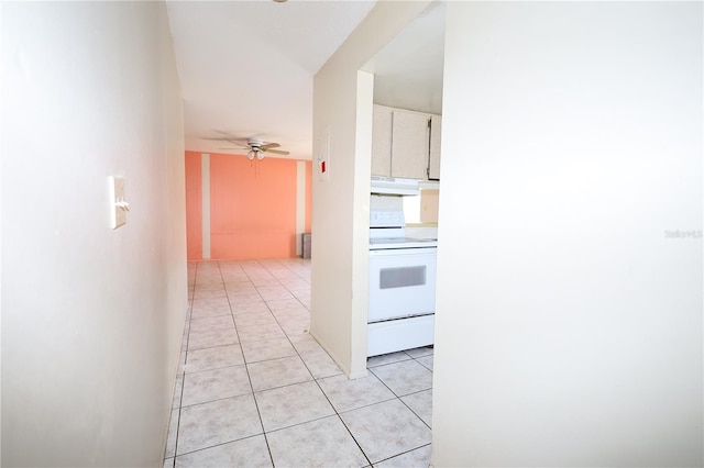 hall featuring light tile patterned flooring