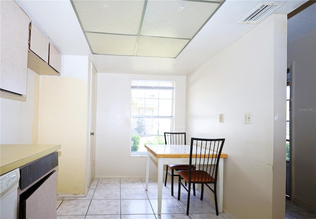 dining room featuring light tile patterned floors and visible vents