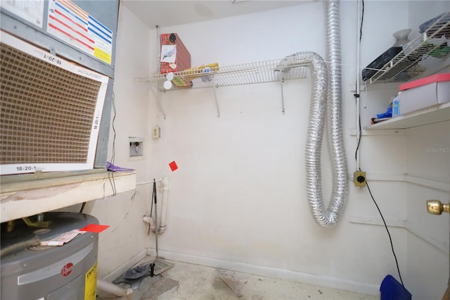 interior space featuring electric water heater, hookup for a washing machine, and laundry area