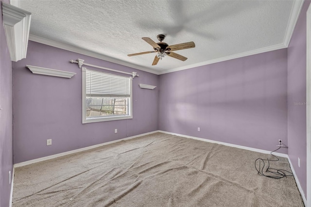 carpeted empty room with baseboards, a textured ceiling, a ceiling fan, and crown molding