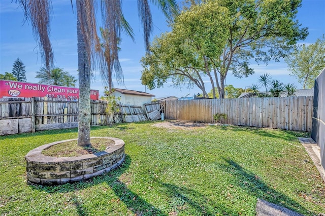 view of yard with a fenced backyard