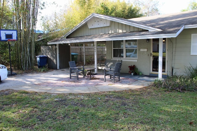 view of patio / terrace featuring fence