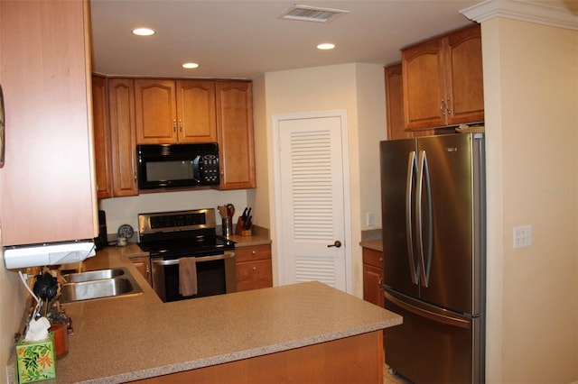 kitchen with light countertops, recessed lighting, visible vents, and appliances with stainless steel finishes