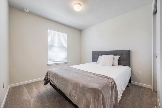 carpeted bedroom with baseboards