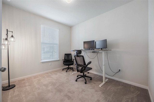 home office with baseboards and carpet floors