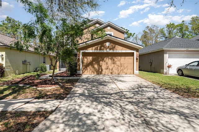 view of front of house featuring stucco siding and concrete driveway