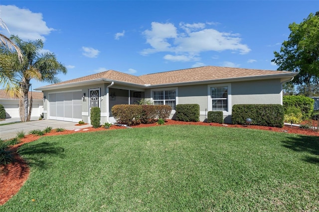 ranch-style house with stucco siding, a garage, concrete driveway, and a front lawn