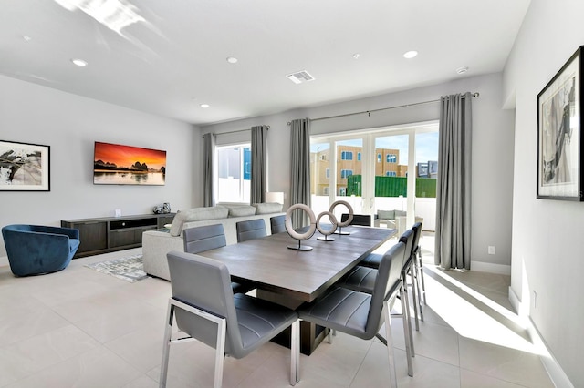 dining room with light tile patterned floors, visible vents, recessed lighting, and baseboards