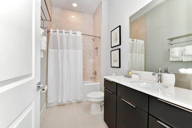 bathroom with tile patterned floors, toilet, shower / bath combo, and vanity