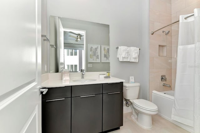 full bath featuring shower / tub combo, toilet, vanity, and tile patterned flooring