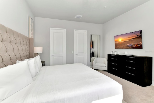 bedroom with carpet flooring and visible vents