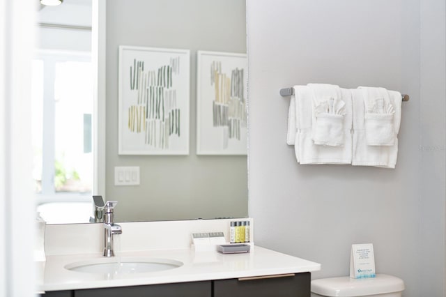 bathroom with vanity and toilet