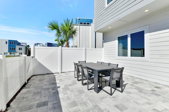 view of patio featuring outdoor dining area and a fenced backyard