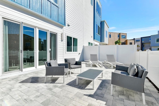 view of patio / terrace with outdoor lounge area and fence