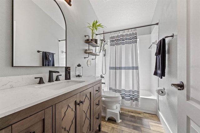 full bathroom with toilet, wood finished floors, a textured ceiling, vanity, and shower / bathtub combination with curtain