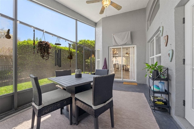 sunroom with a ceiling fan