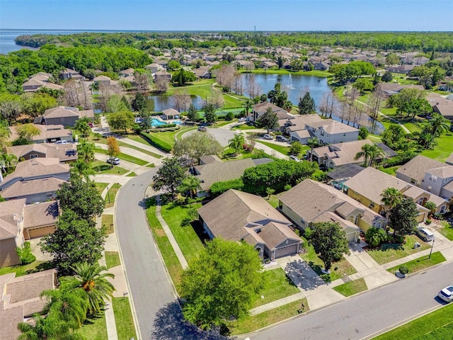 bird's eye view with a residential view and a water view