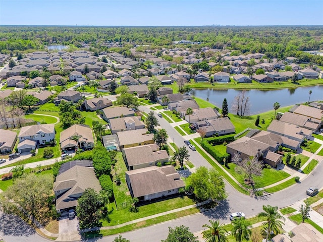 bird's eye view with a residential view and a water view