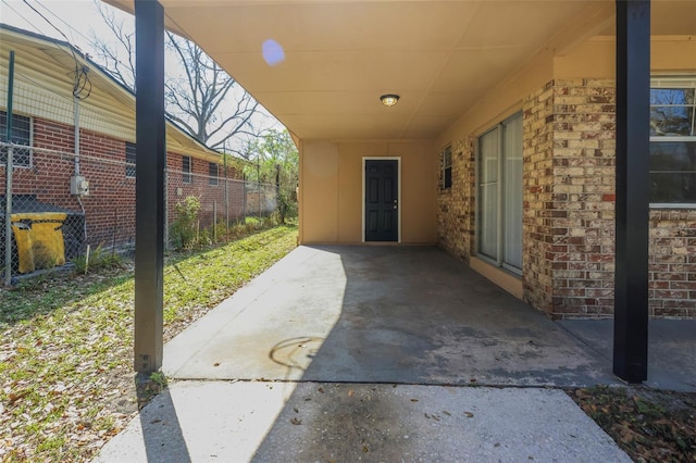 2108 W 15th, Jacksonville, FL 32209 - view of patio / terrace featuring an attached carport and fence