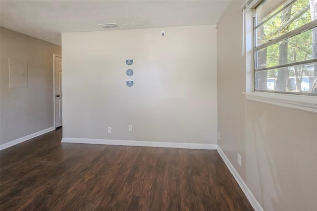 2108 W 15th, Jacksonville, FL 32209 - unfurnished room with visible vents, baseboards, and dark wood-style flooring
