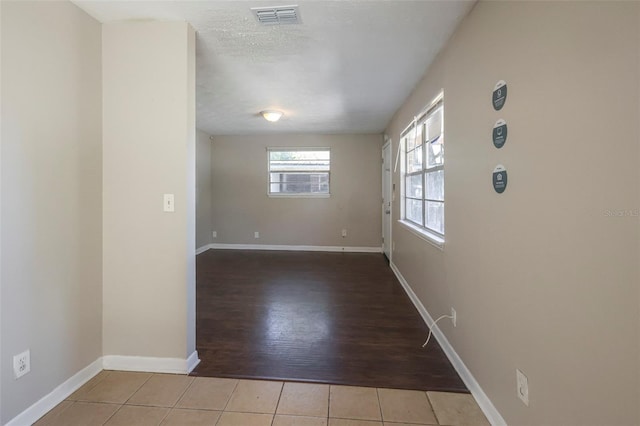 2108 W 15th, Jacksonville, FL 32209 - spare room with tile patterned floors, visible vents, a textured ceiling, and baseboards
