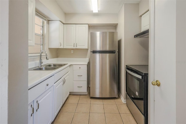 2108 W 15th, Jacksonville, FL 32209 - kitchen featuring light countertops, freestanding refrigerator, electric range, white cabinets, and a sink