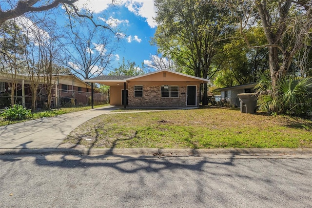 2108 W 15th, Jacksonville, FL 32209 - view of front of property featuring a front lawn, a carport, fence, concrete driveway, and brick siding