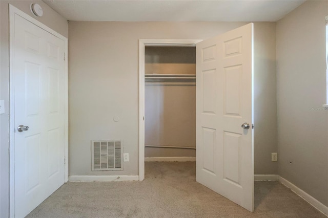 2108 W 15th, Jacksonville, FL 32209 - unfurnished bedroom with baseboards, visible vents, a closet, and carpet floors
