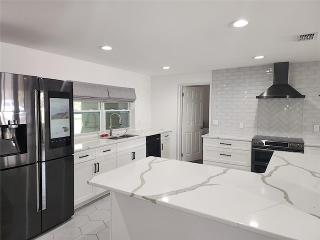 kitchen featuring electric range, visible vents, white cabinetry, ventilation hood, and stainless steel fridge with ice dispenser