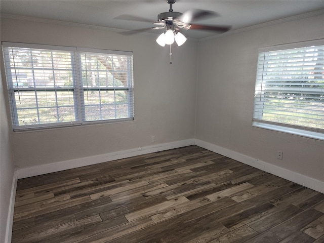 spare room featuring a ceiling fan, crown molding, a healthy amount of sunlight, and dark wood-style flooring