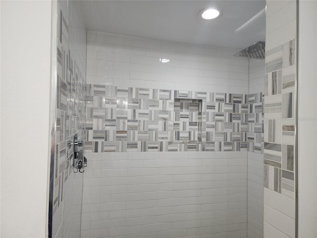 bathroom with a tile shower