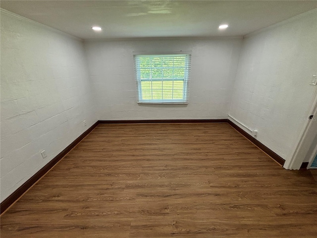 unfurnished room with recessed lighting, baseboards, ornamental molding, and dark wood-style flooring