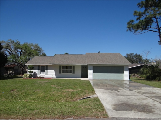 ranch-style house with an attached garage, concrete driveway, a front lawn, and a shingled roof