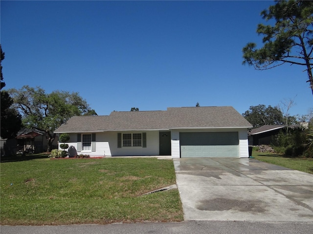 single story home with a garage, concrete driveway, and a front yard