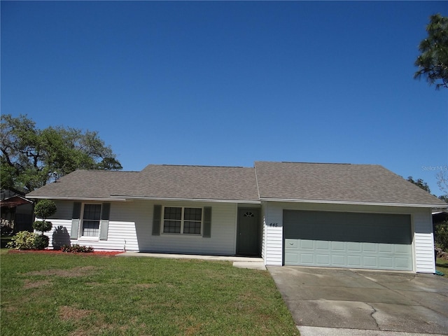 single story home with a garage, concrete driveway, a front yard, and roof with shingles