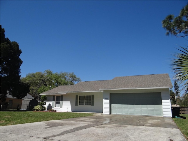 ranch-style house featuring a front lawn, a garage, driveway, and a shingled roof