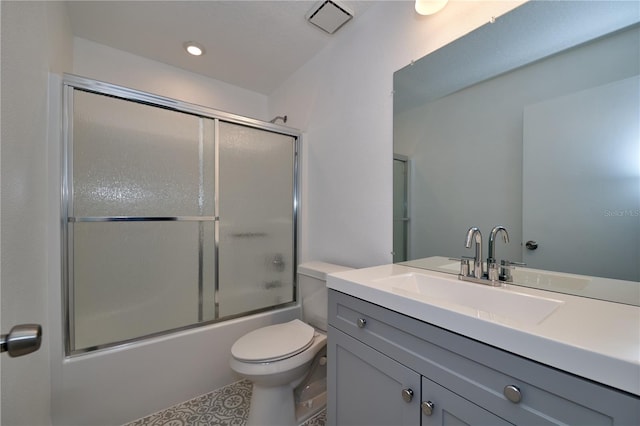 full bathroom with vanity, toilet, recessed lighting, and enclosed tub / shower combo