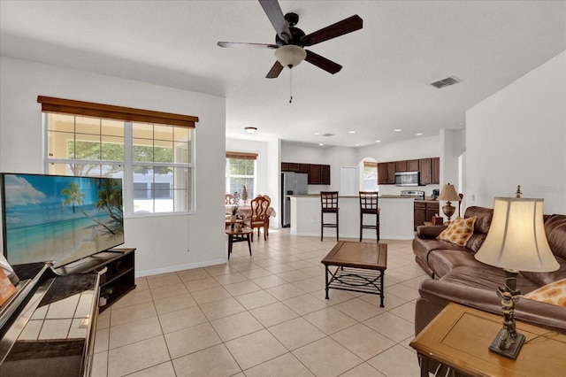 living room with baseboards, visible vents, light tile patterned flooring, recessed lighting, and ceiling fan