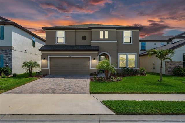 12654 Oak Hill Way, Parrish, FL 34219 - view of front of house with stucco siding, a garage, driveway, and a yard