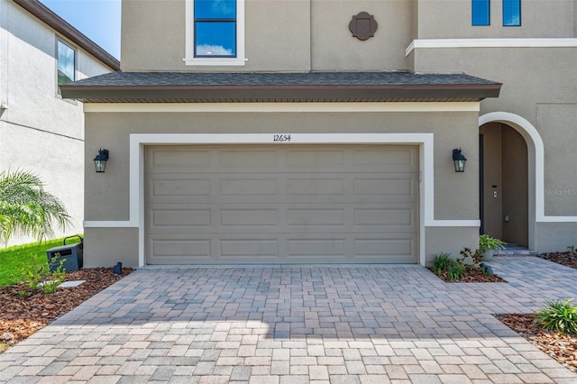 12654 Oak Hill Way, Parrish, FL 34219 - garage with decorative driveway