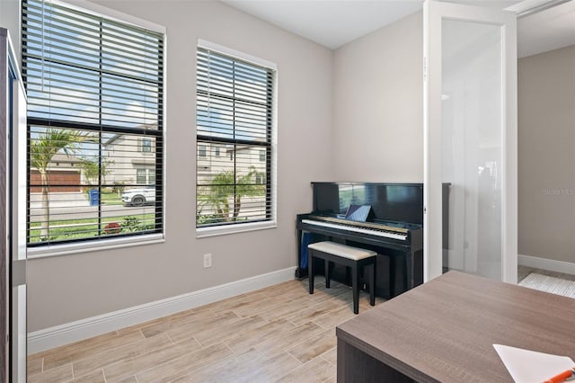12654 Oak Hill Way, Parrish, FL 34219 - sitting room with plenty of natural light, baseboards, and wood finish floors